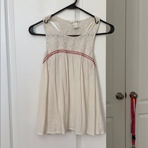 White sleeveless top with embroidery